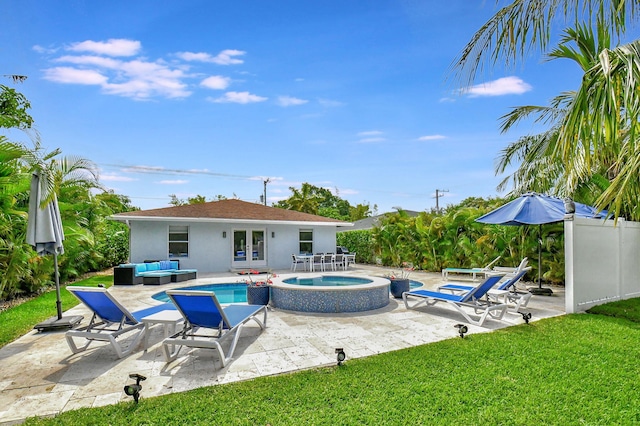 view of swimming pool featuring a patio area and an in ground hot tub