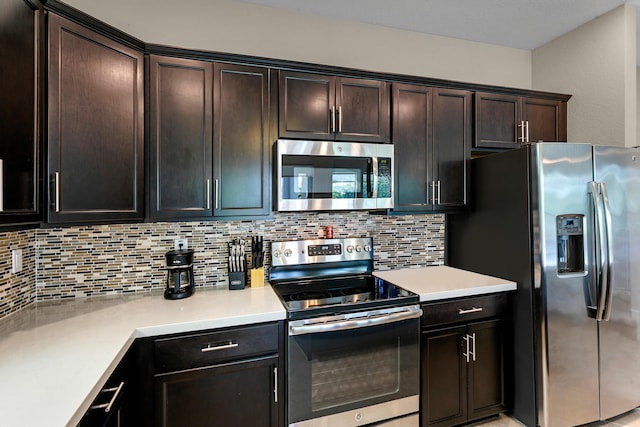 kitchen featuring dark brown cabinets, stainless steel appliances, and tasteful backsplash