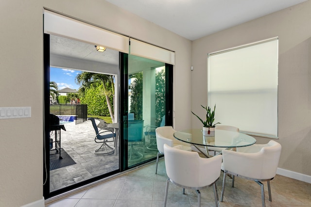 dining area with light tile patterned flooring