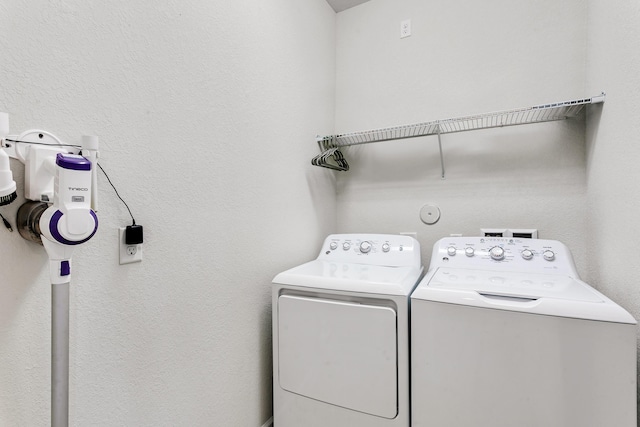 laundry room with washing machine and clothes dryer