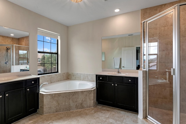 bathroom featuring separate shower and tub, tile patterned flooring, and vanity