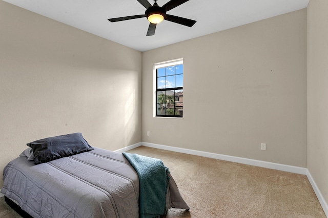 bedroom featuring ceiling fan and carpet floors