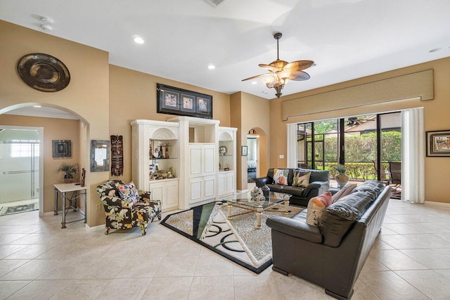 tiled living room featuring ceiling fan