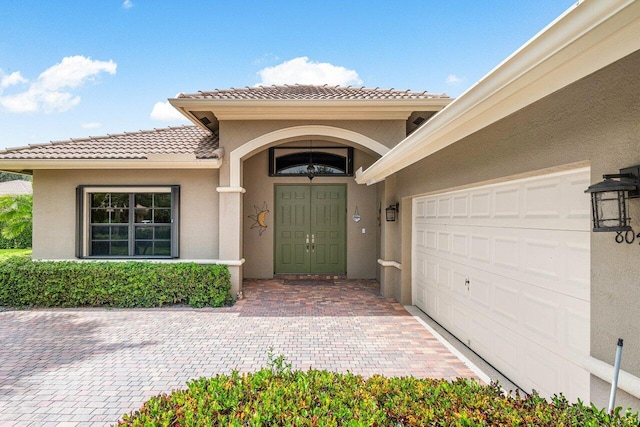 doorway to property featuring a garage