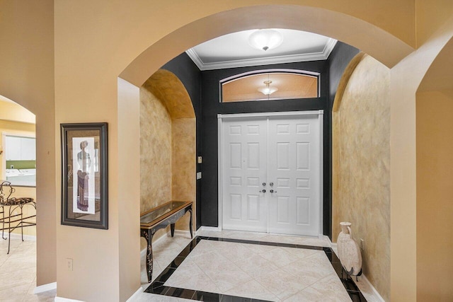 entryway featuring light tile patterned flooring and ornamental molding