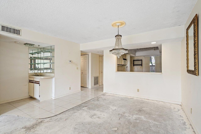 bedroom featuring ceiling fan, a wall of windows, and a textured ceiling