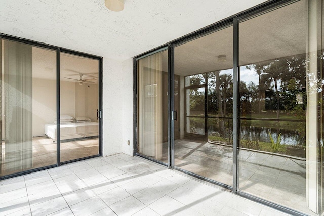 interior space featuring ceiling fan