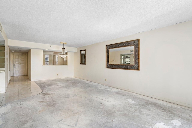 spare room featuring a textured ceiling