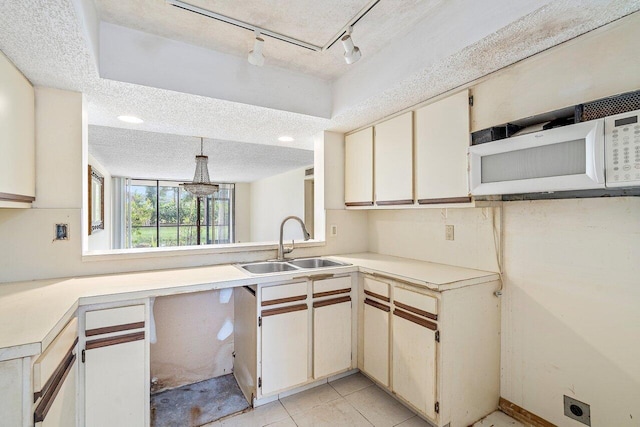 spare room with a wall of windows and a textured ceiling