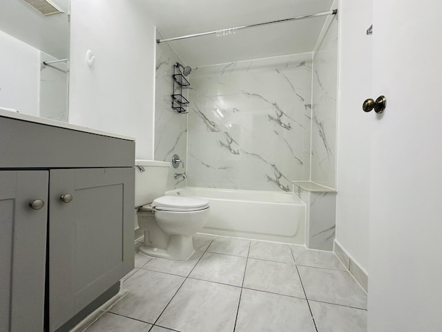 full bathroom featuring tiled shower / bath, vanity, and toilet