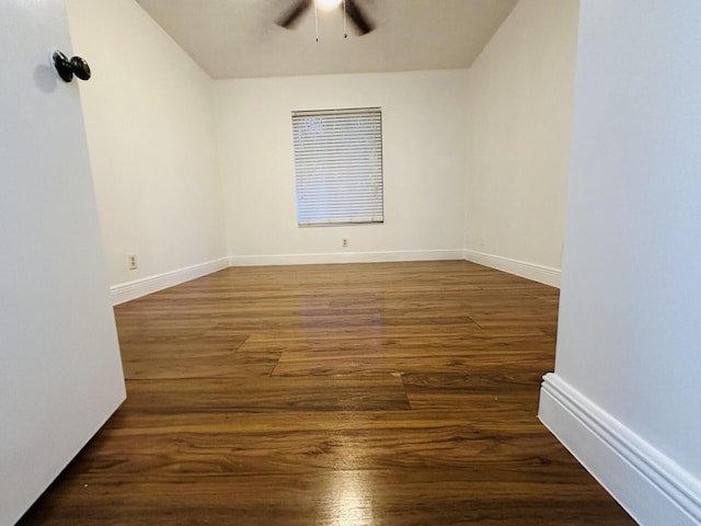 unfurnished room with dark wood-type flooring and ceiling fan