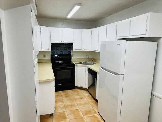 kitchen featuring dishwasher, sink, white cabinets, white refrigerator, and black electric range