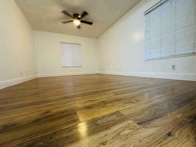 spare room featuring ceiling fan and dark hardwood / wood-style flooring