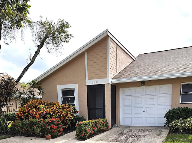 view of front of property with a garage