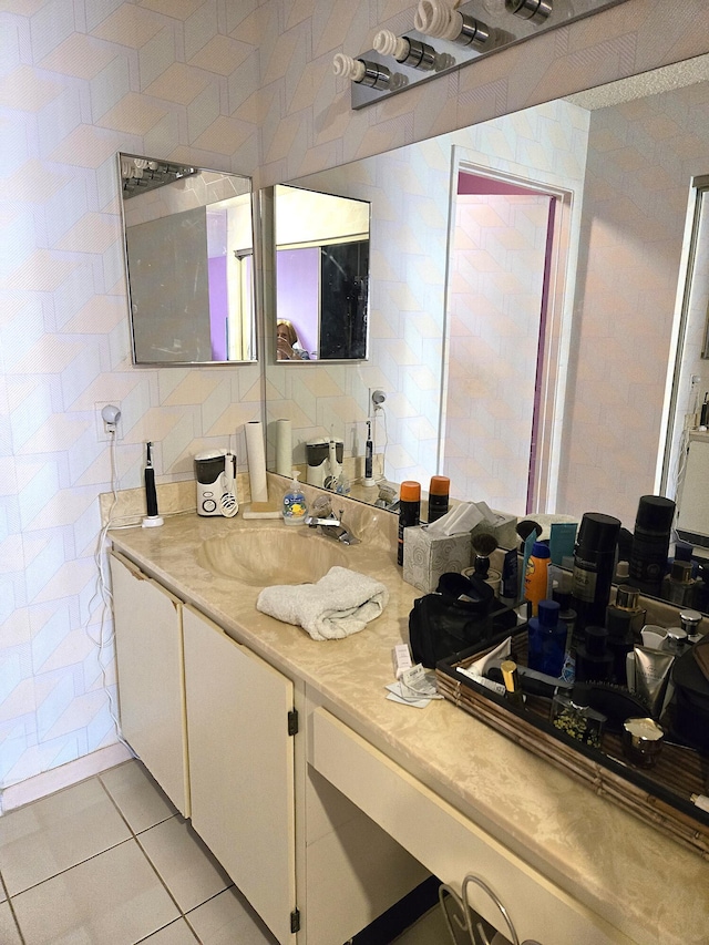 bathroom with tile patterned floors, decorative backsplash, vanity, and tile walls