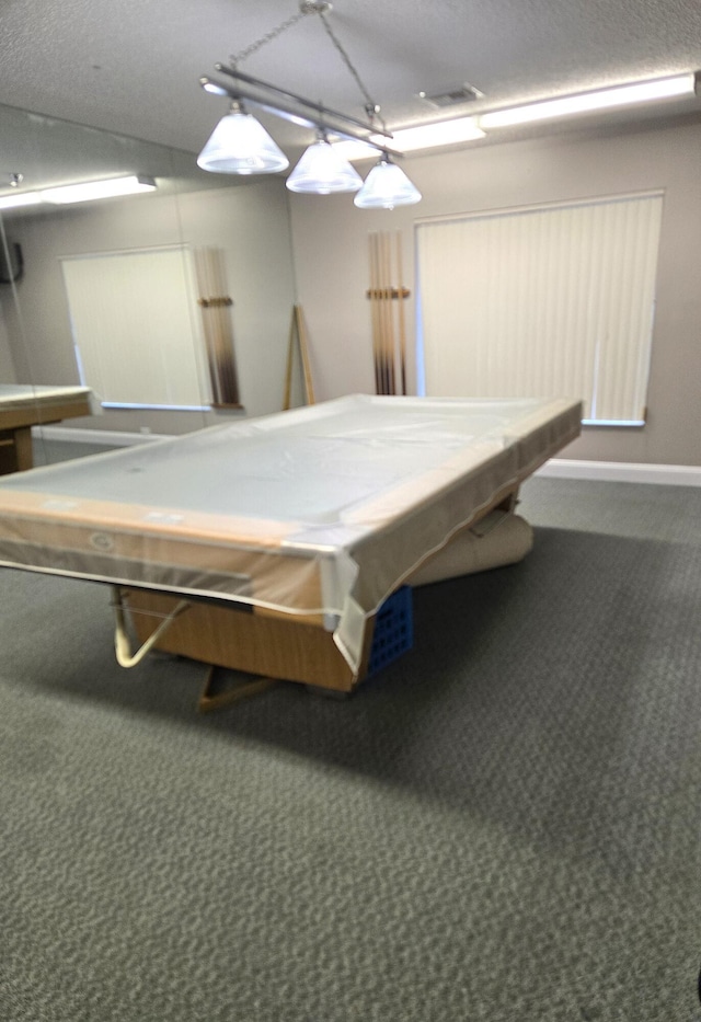 playroom featuring carpet flooring, a textured ceiling, and billiards