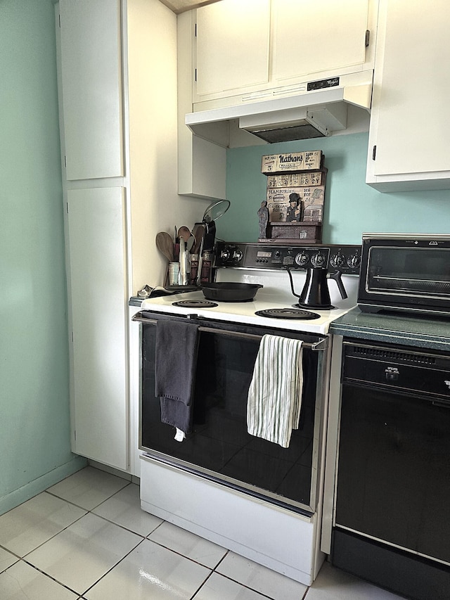 kitchen with white cabinets, light tile patterned flooring, and electric stove