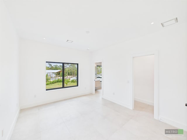 13613 157th Ct N, Jupiter, FL 33478 - empty room with baseboards and light tile patterned floors