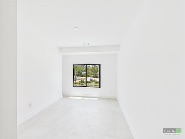 13613 157th Ct N, Jupiter, FL 33478 - empty room featuring light tile patterned floors, baseboards, and recessed lighting