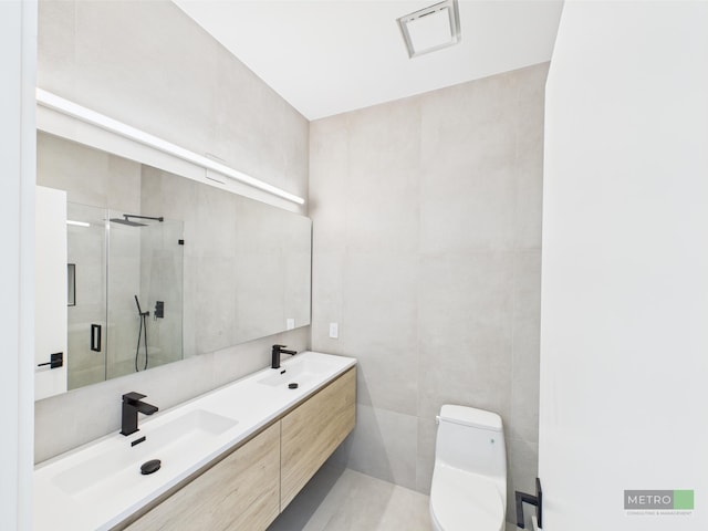 13613 157th Ct N, Jupiter, FL 33478 - full bath with a shower stall, tile walls, toilet, and double vanity