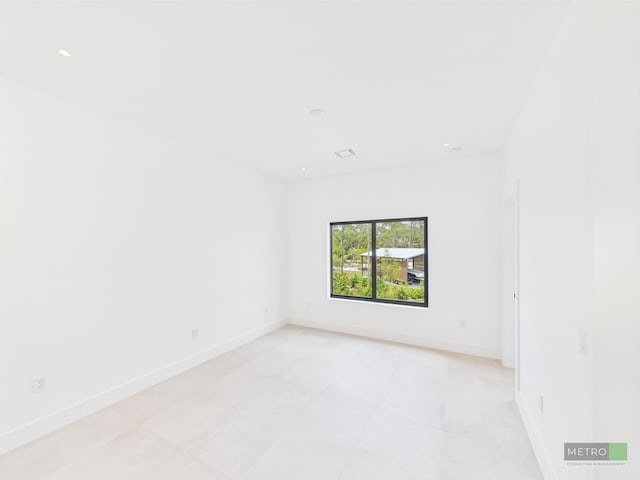 13613 157th Ct N, Jupiter, FL 33478 - spare room featuring light tile patterned flooring, baseboards, and recessed lighting