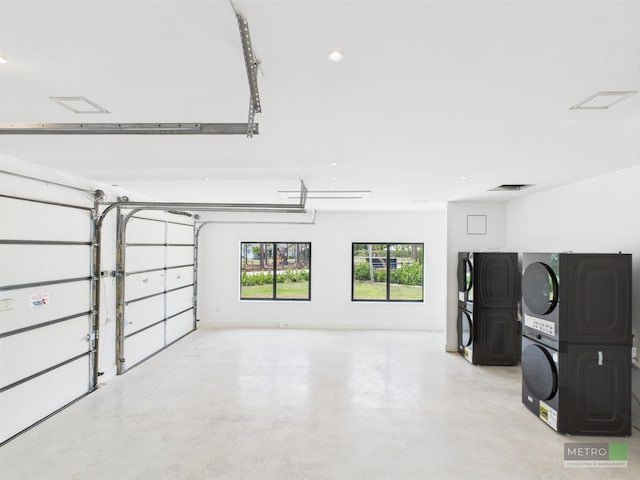 13613 157th Ct N, Jupiter, FL 33478 - garage featuring stacked washer / dryer and recessed lighting
