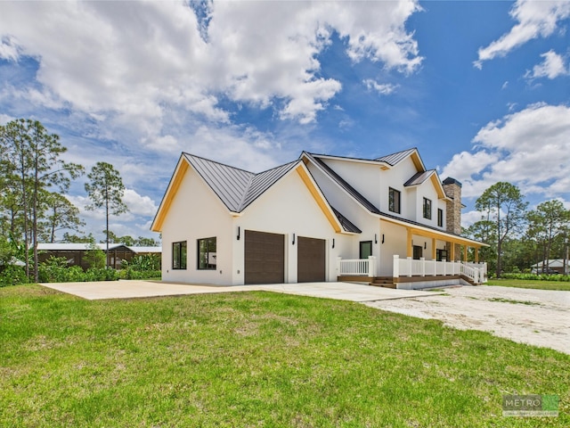13613 157th Ct N, Jupiter, FL 33478 - modern farmhouse with a standing seam roof, stucco siding, a garage, metal roof, and a front yard