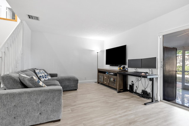 living room with light hardwood / wood-style floors