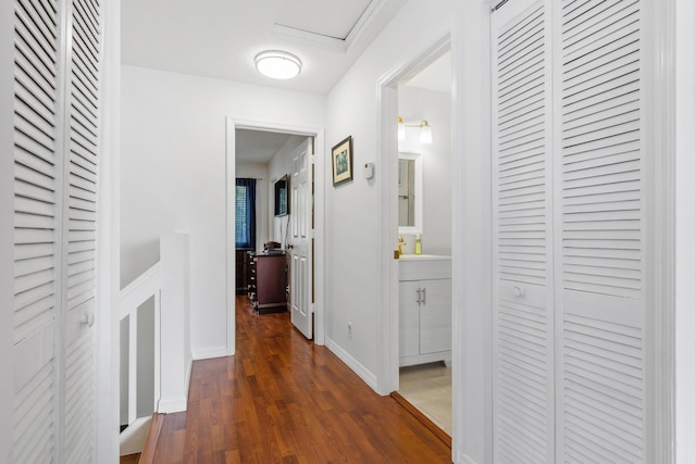 hall with dark hardwood / wood-style floors