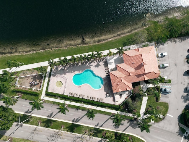 birds eye view of property featuring a water view