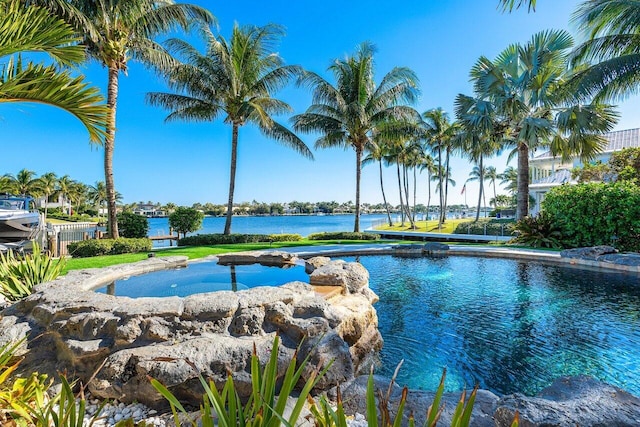 view of swimming pool featuring a water view