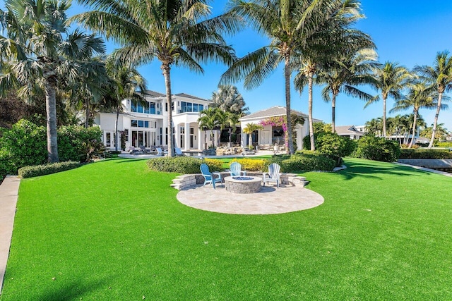 view of yard with a patio and a fire pit