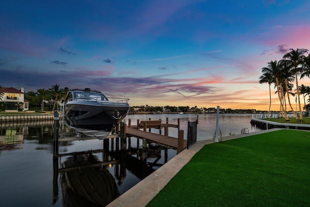 dock area featuring a yard and a water view