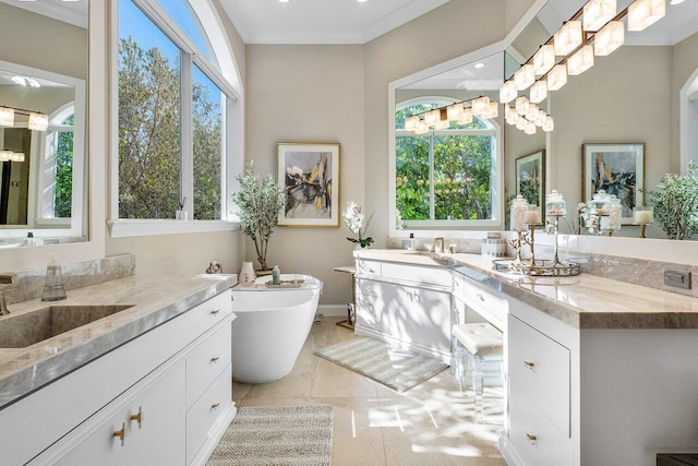 bathroom featuring tile patterned floors, plenty of natural light, vanity, and ornamental molding