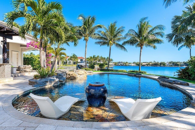 view of pool with a water view