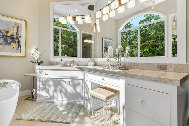 bathroom with tile patterned flooring and vanity