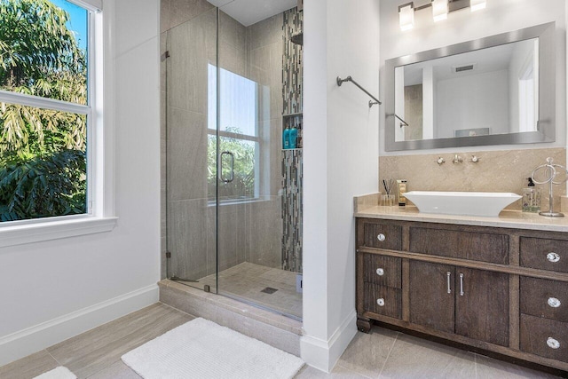 bathroom featuring hardwood / wood-style floors, vanity, and a shower with shower door