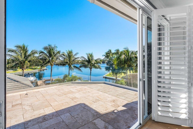 exterior space with a balcony and a water view