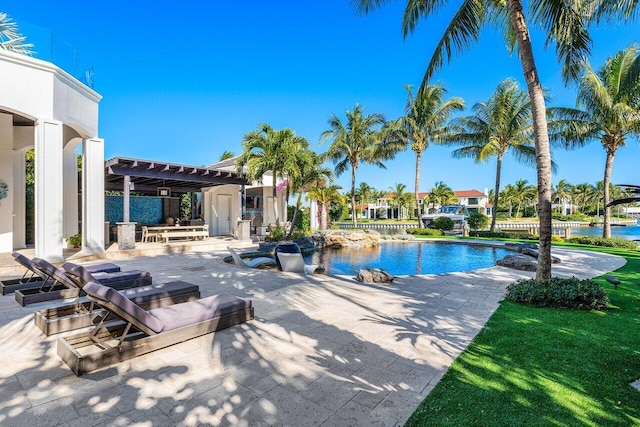 view of pool with a pergola, a water view, and a patio area