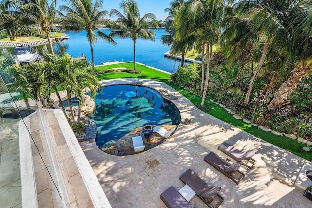 view of pool with a water view and a patio