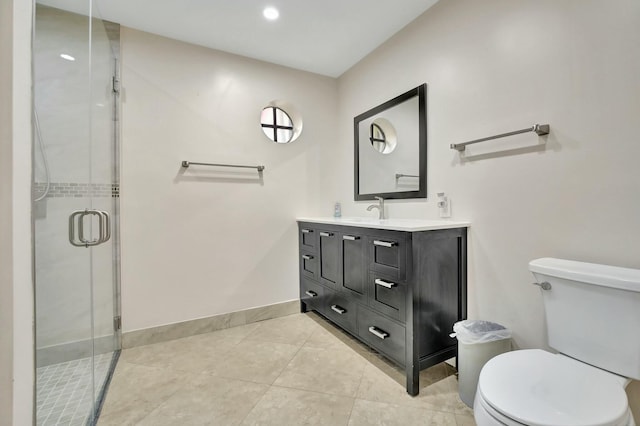 bathroom with toilet, vanity, and walk in shower