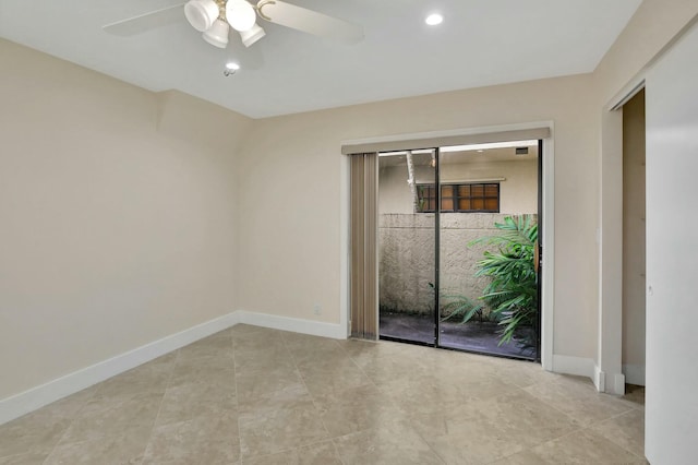 unfurnished room featuring ceiling fan and light tile patterned flooring