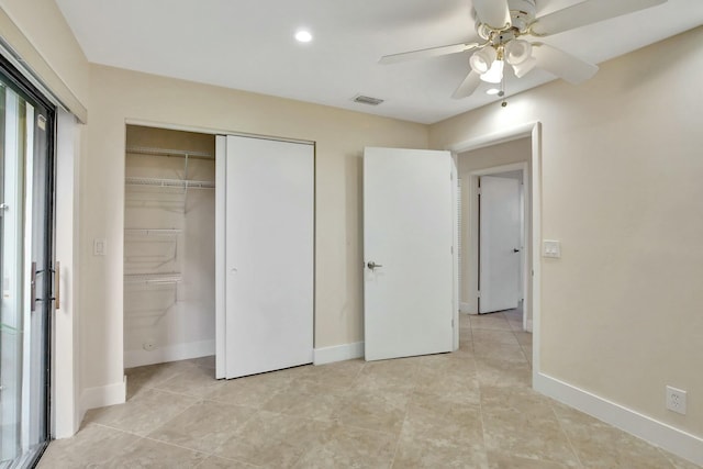 unfurnished bedroom with ceiling fan and light tile patterned flooring