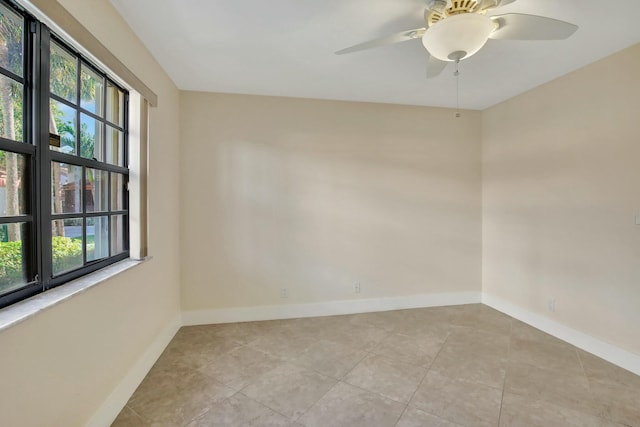 unfurnished room with light tile patterned floors and ceiling fan