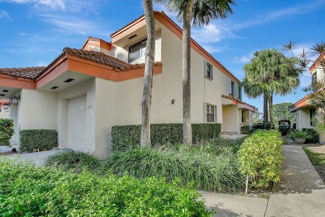 view of property exterior with a garage