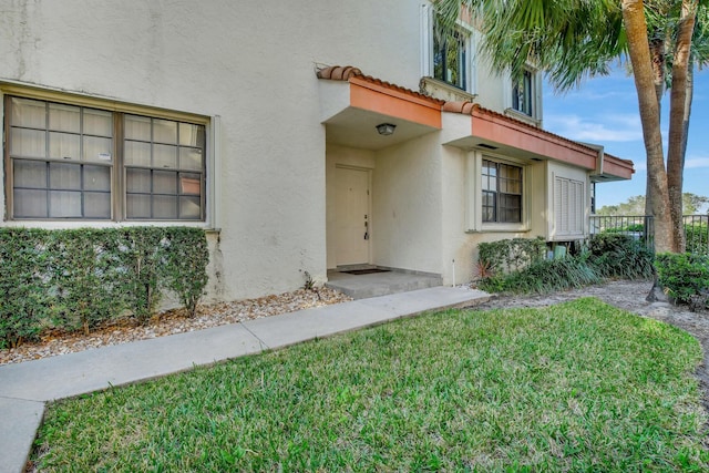 entrance to property with a yard