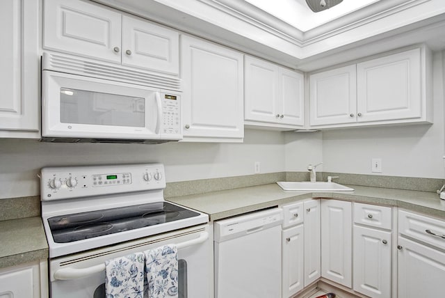 kitchen featuring white cabinets, white appliances, and sink