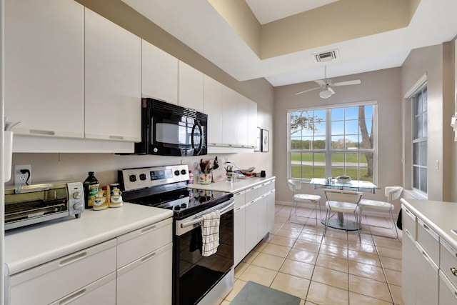 kitchen with ceiling fan, light tile patterned floors, white cabinets, and stainless steel electric range