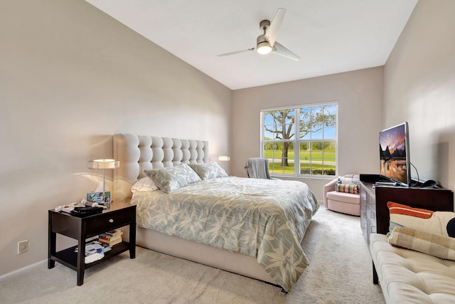 carpeted bedroom featuring ceiling fan and vaulted ceiling