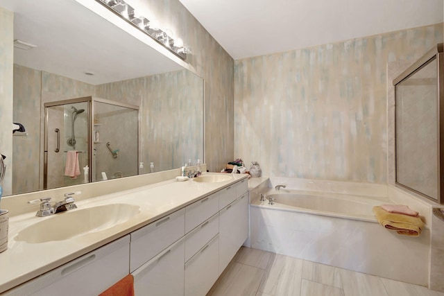 bathroom featuring separate shower and tub and vanity